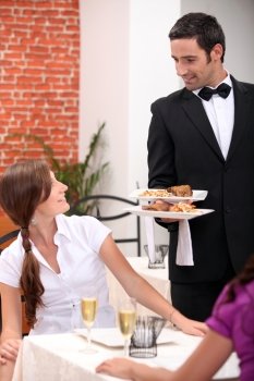 waiter serving a table