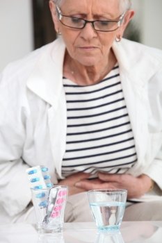 Woman about to take pain relievers