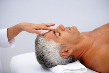 Mature man having facial massage