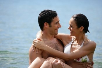 Couple embracing in the sea