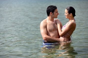 Couple embracing in the water