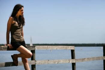 Woman stood alone on jetty
