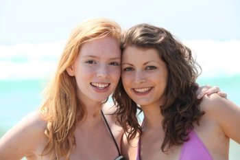 Friends standing on the beach