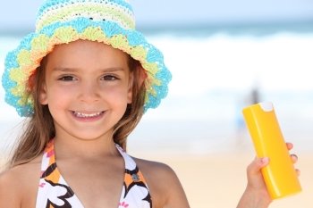 Girl holding sun-cream