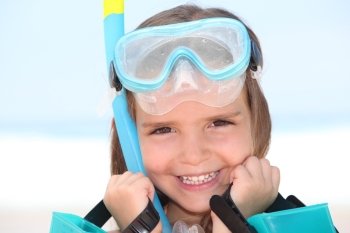 portrait of a little girl with mask and snorkel