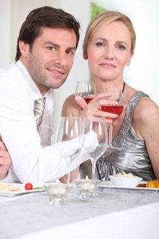 couple enjoying wine with dinner