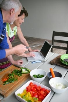 Couple looking at a recipe on-line