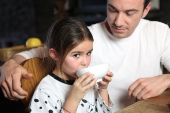 Father at breakfast with his daughter