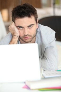 serious-looking guy with laptop