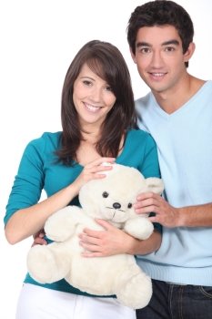 Young couple with a teddy bear