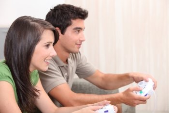 portrait of teenagers playing video game