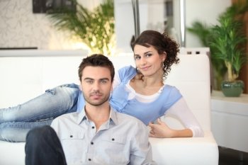 Couple relaxing in living room