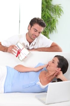 Man offering gift to wife