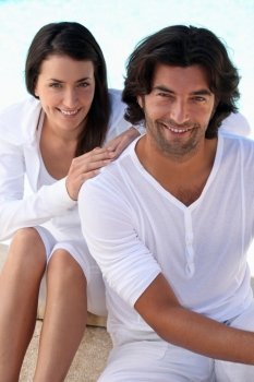 Studio portrait of a relaxed couple on white