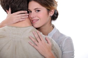 a woman hugging a man