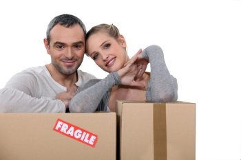 Couple stood with storage boxes