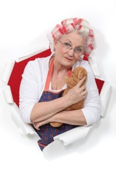 Elderly woman holding teddy