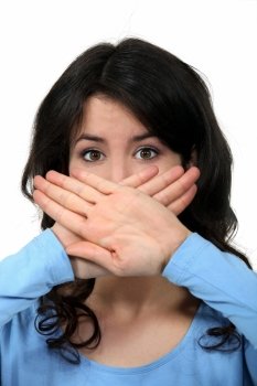 woman covering her mouth with her hands