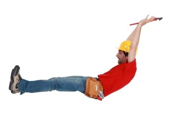 Tradesman jumping in the air