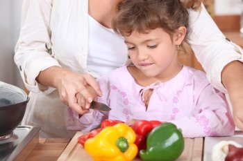 Girl cutting Peppers