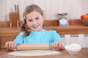 little girl preparing tart