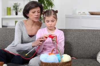 Mother and daughter knitting