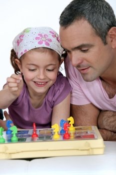 Little girl playing  board game