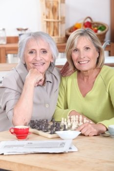 Mature women playing chess