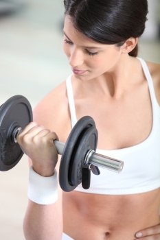 a woman lifting a barbell