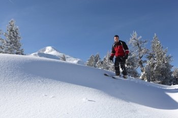 Male skier on a ski slope