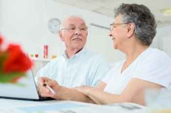elderly couple having a conversation