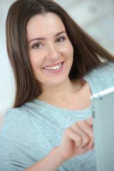 Woman using her tablet computer