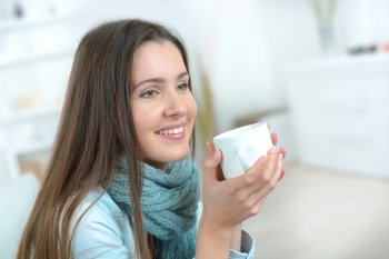 Woman holding  mug of coffee