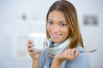 Woman having a coffee at home