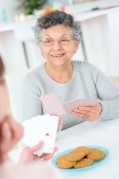 Old lady playing cards