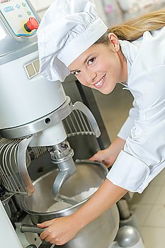 Chef using industrial mixer