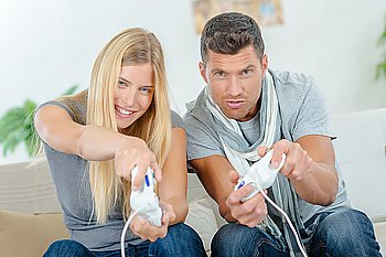 Couple competing at computer games