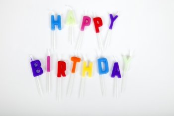 Birthday candles against white background