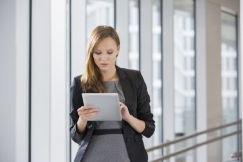 Businesswoman using tablet PC in office