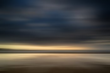 Blur effect on landscpae image to create artistic impression of beach landscape