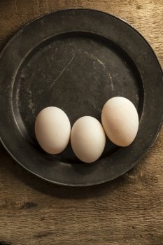 Fresh duck eggs in moody vintage style natural lighting set up