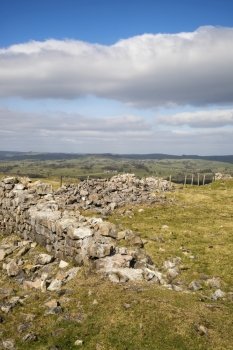 Ruins of abandoned copper mines in landscape in Peak District in Uk