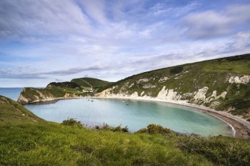 Beautiful Summer morning landscape over Lulworth Cove in England
