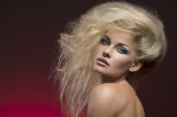 close-up portrait of sexy blonde woman with creative bushy hair-style and cute make-up 