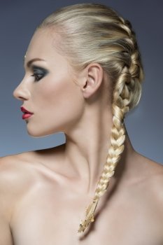 close-up portrait of female profile with creative strong make-up and bride blonde hair-style 