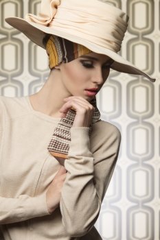 cute fashion shot of cool lady in sensual pose with coordinated beige hat and dress, elegant style, pretty make-up