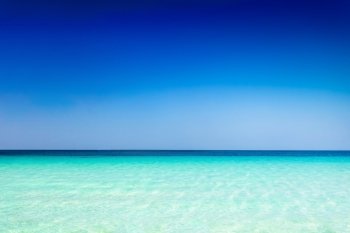 Turquoise sea water and blue sky background