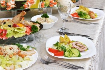  stuffed turkey fillet with potato and vegetables on table