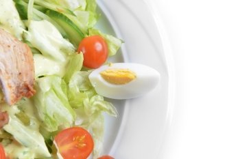 Fresh salad with lettuce, cherry  tomato and meat on dish