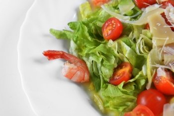 Salad with seafood, romaine salad leaf and cheese